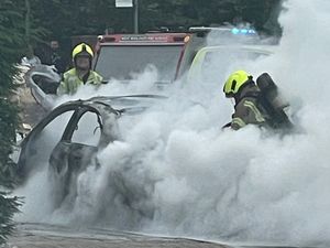Supporting image for story: Smoke pours across Dudley town centre as fire destroys car