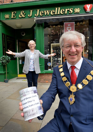 Owner Jeanette Sherry shows the money to mayor Phil Gillam as a ‘thank you’ for judging the pumpkin contest last year