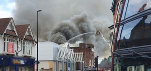 The fire sent plumes of black smoke into the air and caused nearby roads to be closed