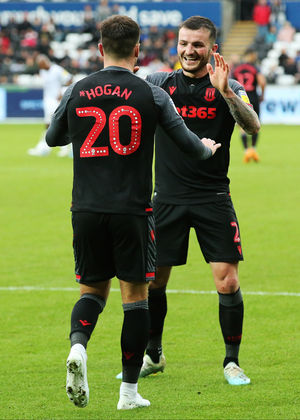 Stoke City's Scott Hogan celebrates with Tom Edwards