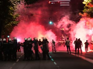 Supporting image for story: Serbian riot police fire tear gas at anti-government protesters