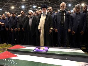 Supporting image for story: Iran’s supreme leader prays over coffin of Hamas leader