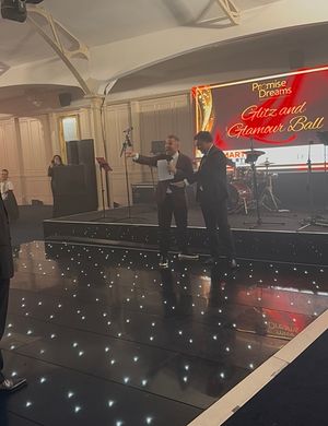 Aaron James and Don Goodman on stage at the Promise Dreams event