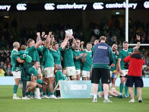 Ireland players lift the Lansdowne Cup following the win over Australia