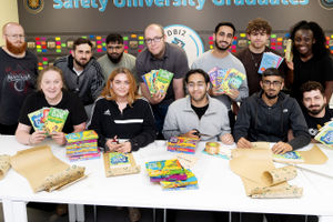 Associates wrapping children’s books
Left to right, Front, Lizzie White, Aimee O’Reilly, Mohamed Jamal Miah, Hamza Muhammad, Borin Cojocaru, Back, Adam Smith, Jake Ashurst, Zahid Ahmad, Tom West, Akeel Malik, Hayden Palmer, Yaa Ampofowaa Owusu