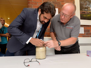 Dr Alexander Joseph and George Tipper open the 1903 capsule