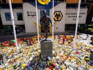 Supporting image for story: Molineux's Diogo Jota tribute: 14 emotional pictures show sea of flowers, shirts and scarves at home of Wolves