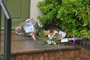 Flowers left outside The Fighting Cocks Pub in Stottesdon, following the death of a woman in her 50s
