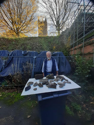 Martin Crowdy shows how much masonry has fallen off a wall near St Laurence's Church in Ludlow. Picture supplied by Martin Crowdy