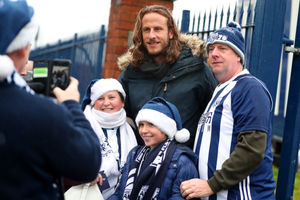 Jonas Olsson former West Bromwich Albion player stops to pose for photographs as he arrives at the FanZone to say goodbye properly to the West Bromwich Albion Fans (AMA)