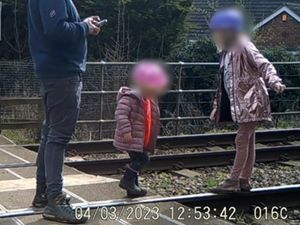 Supporting image for story: Shocking CCTV footage shows man letting toddlers play on railway tracks as train approaches