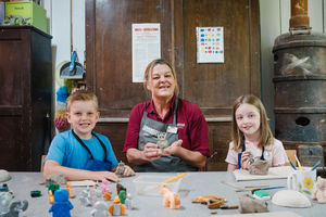 Justine Ranson, Visitor Engagement Team Leader at Coalport China Museum, with Abel Sumnall and Evelyn Wood
