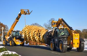 The sculpture being moved into place.