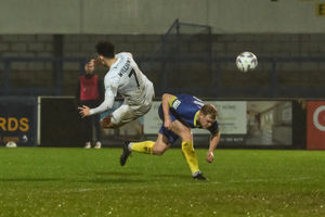 Charlie Williams is sent flying during AFC Telford United's 3-0 victory against Hereford on Tuesday night (Picture: Kieren Griffin)