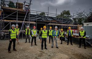 Meole Brace School new teaching hub – visit. Left to right: Phil Wilson, Adam Dennett, Eilian Jones, Dawid Cloete, Karen Bradshaw, Councillor Jeff Anderson, Tim Smith, Harvey Gould, Councillor Kirstie Hurst-Knight, Carl Wellington and Peter Allen.