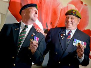 Supporting image for story: Parade marshal Dave passes his baton to fellow Market Drayton veteran