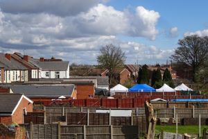 **Number plates may need pixelating/Video with Relevant Desk** (Pictured: West Midlands Police are searching the rear garden of a terrace house on St Paul's Road in the Smethwick area of Sandwell after officers followed a new line of enquiry into the disappearance of Phillip Harris who went missing aged 15 on 28 July 1999. Cops have erected several forensic tents the the garden and placed sheeting from the rear of the property to the tenting. Forensic officers were also pictured coming and going from the property with photographic equipment. Pic taken 01/04/2022) - WEST MIDLANDS POLICE STATEMENT:..Appeal for missing teenager 23 years on..The disappearance of a Sandwell teen nearly 23 years ago has remained a mystery since he told his family he was going to spend the night at a friendâs house and never returned...Phillip Harris was just 15 when he left his home in St Eleanors Close, West Bromwich on the morning of 28 July 1999 to visit a friend in Northfield. Later that day he phoned his foster parents to say he would be staying overnight with a friend. He hasnât been seen since...In spite of media appeals, both in Birmingham and Manchester, where he had family links, there have been no confirmed sightings of him...Detectives reviewing the case are now searching a property in St Paulâs Road, Smethwick which was linked to Phillip at the time. The current residents are not connected to this enquiry and have been rehoused while our search is conducted...Detective Inspector Jim Church, from force CID, said: 'Sadly there has been no proof of life for Phillip in all these years and we need to explore all the information we have to see if we can find out what happened to him. ..'We have been in touch with Phillipâs family and made them aware of our investigations...'Even though it is almost 23 years ago, we are sure that someone holds the key to Phillipâs disappearance and we would urge anyone with information to contact us.'..Phillipâs family said: 'We think ab.