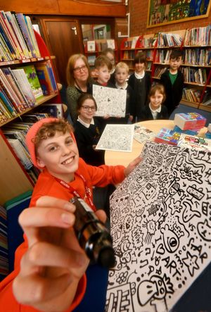 Doodle Boy Joe Whale at Radbrook Primary School for World Book day - with him is teacher Sue Brady, Poppy, 10, Dougie, 6, Josh, 7, Arthur, 5, Hattie, 5, Willow, 9 and Harvey, 6