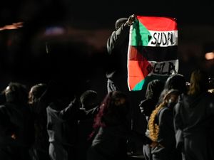 Supporting image for story: Super Bowl halftime performer detained after unfurling Sudan-Palestine flag