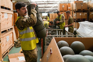 Members of the military pack thousands of surplus helmets donated by the army for 'Hats off to Ukraine', at MOD Donnington in Shropshire
