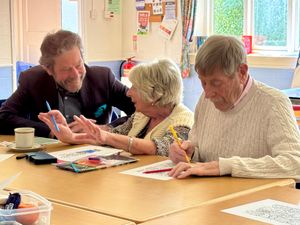 Roger Pemberton of Shropshire Freemasons sharing a moment of creativity and conversation with group members from Community Resource.