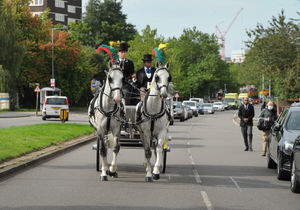 Her coffin was placed in a white carriage pulled by horses