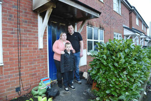 Steve and Joanne Weaver with Morgan outside their home