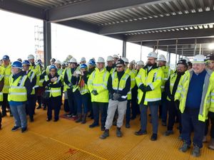 Invited guests at the RSH ward block topping out ceremony kitted out in high vis safety jackets. Picture: LDRS