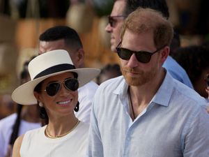 Supporting image for story: Meghan wears ‘big smile’ during visit to Colombian music school with Harry