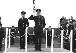 Taking the salute at a graduation parade.