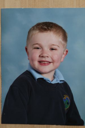 Luke as a little boy, with his ready smile