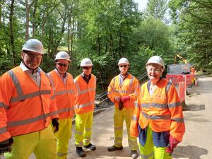 Councillor Heather Kidd with the workers tasked with repairing the landslips.