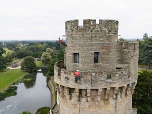 Supporting image for story: In Pictures: Abseiling experts give Warwick Castle a clean-up