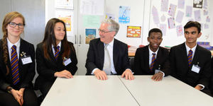 Former Governor of Bank of England Lord Mervyn King, talks to pupils at Colton Hills School, Wolverhampton.