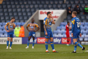 A dejected Oliver Norburn of Shrewsbury Town after Wigan Athletic scored a goal to make it 0-2 (AMA)