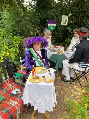 Llandrindod Wells town crier and suffragette Jan Swindale enjoying the picnic in Temple Gardens