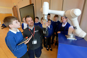 Hadley Learning Community in Telford running a Science and Robotics day for pupils. Pictured student Luca Clarke works a robotic arm with the help of Staffan Willetts.