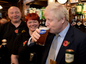 Supporting image for story: GALLERY: Boris Johnson pulls pint in Wolverhampton after Remembrance Day service