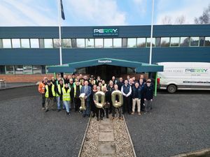 Staff at A. Perry celebrating its 100th birthday