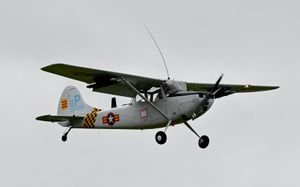 A Bird Dog flies above RAF Cosford