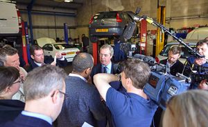 Mr Farage meets the media during a visit to the Bird and Yates Vehicle Repair Centre, in Brookfield Drive, Cannock