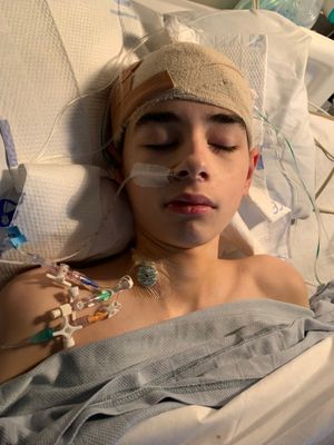 Alex recovering from surgery.