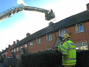 Supporting image for story: Aerial ladder used to fight Ludlow chimney fire