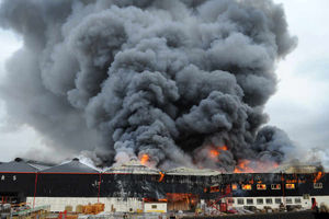 Black plumes of smoke above the blaze at Carvers.