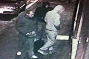 The three men outside the hairdressers shop in High Street, Madeley
