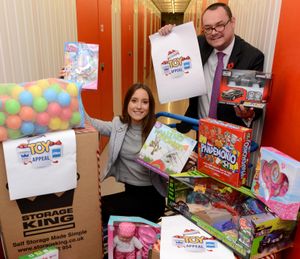 Chloe Edmonds of Storage King and Mark Andrews of the Shropshire Star with the first few toys to be donated