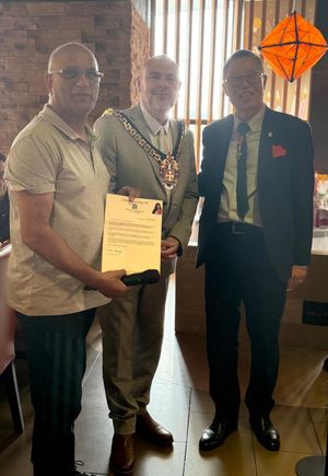 COSMO director Kan Koo, right, with the Mayor of Wolverhampton Cllr Craig Collingswood, centre, and a colleague, left.
