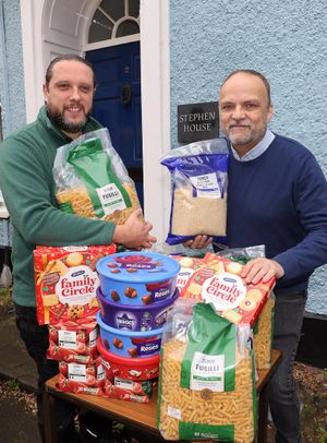 Lock Stock Self Storage Area Manager Alan Brightmore hands over a consignment of Christmas goodies to Paul Kemp at Ludlow’s Stephen House, the St Laurence’s Church town centre hub that helps vulnerable people