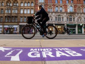 Supporting image for story: Purple pavement markings part of Mind the Grab campaign to tackle phone theft