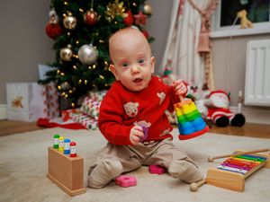 Supporting image for story: Premature baby boy who beat the odds set for Christmas dinner at home